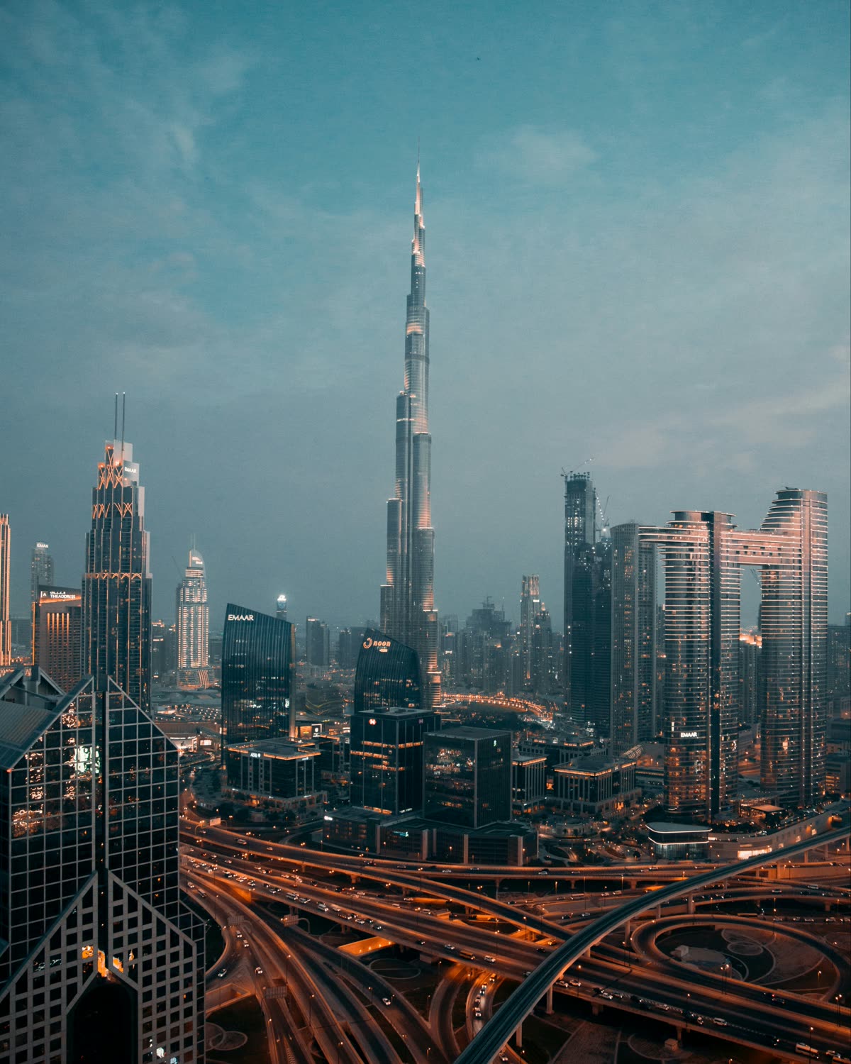 The Dubai skyline at dusk, seen from the Nad Al Sheba district.
